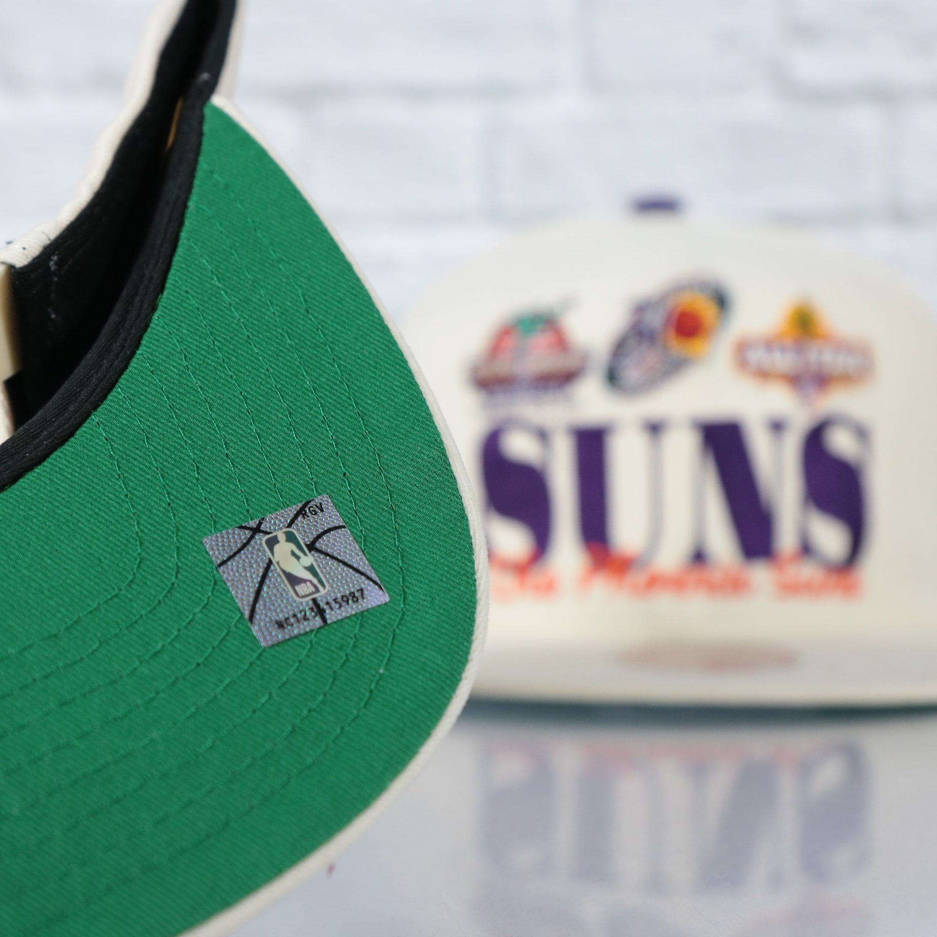 green under visor on the Phoenix Suns Hardwood Classics Reframe Retro Green bottom | Off-White Snapback Hat