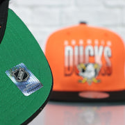 green bottom on the Anaheim Ducks NHL Billboard 2 Green bottom Tri-Tone | Orange/White/Black Snapback Hat