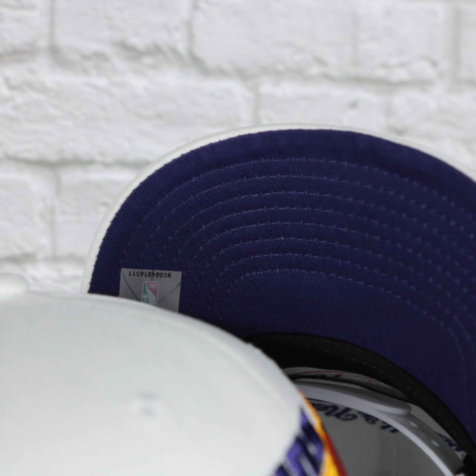 purple under visor on the Phoenix Suns NBA Hardwood Classics All in Pro Purple Bottom | White Snapback Hat