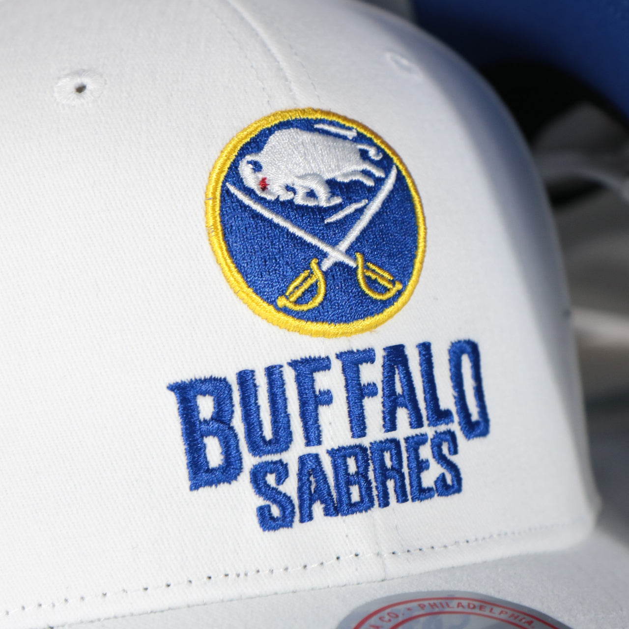 sabres logo on the Buffalo Sabres NHL All in Pro Blue Bottom | White Snapback Hat