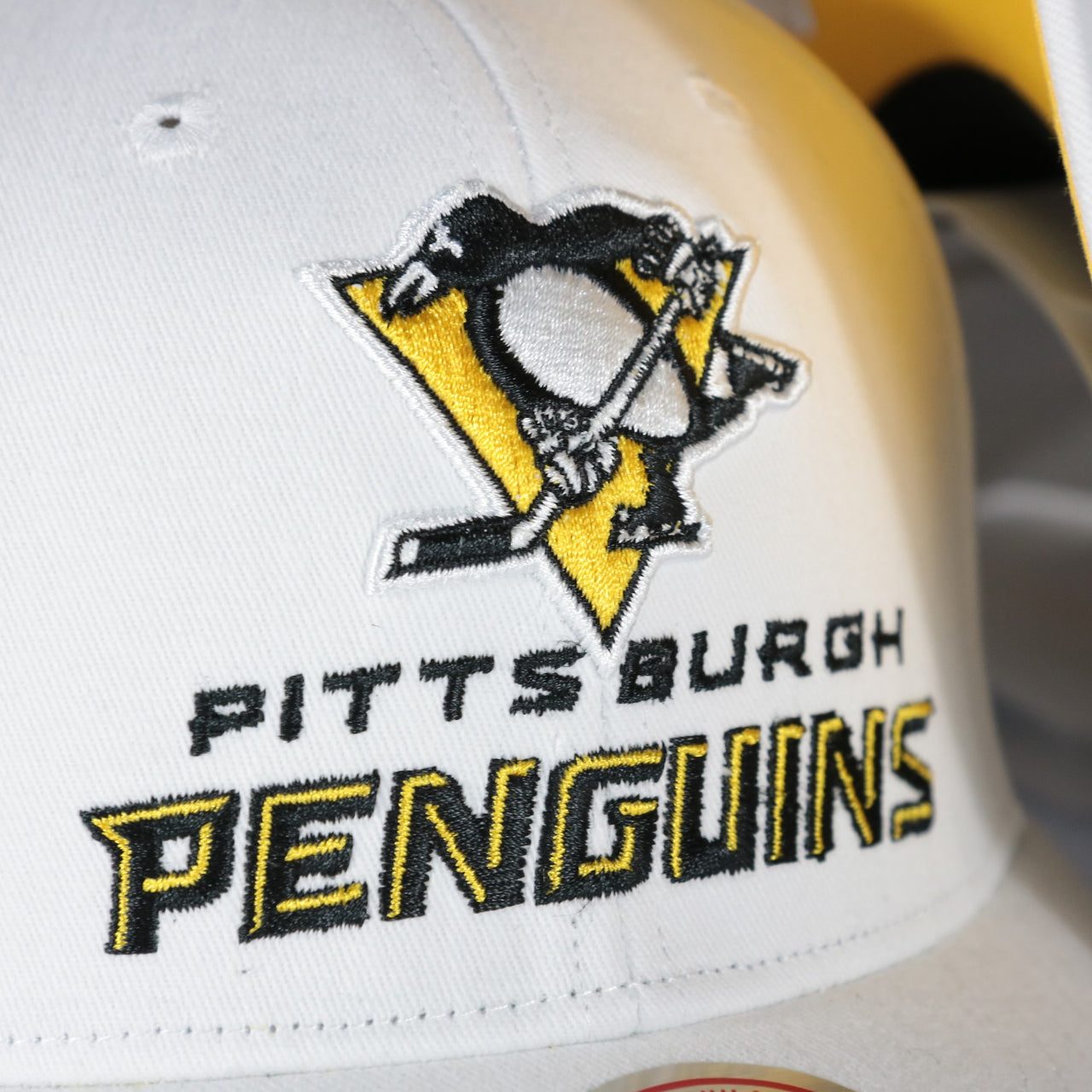 penguins logo on the Pittsburgh Penguins NHL All in Pro Yellow Bottom | White Snapback Hat