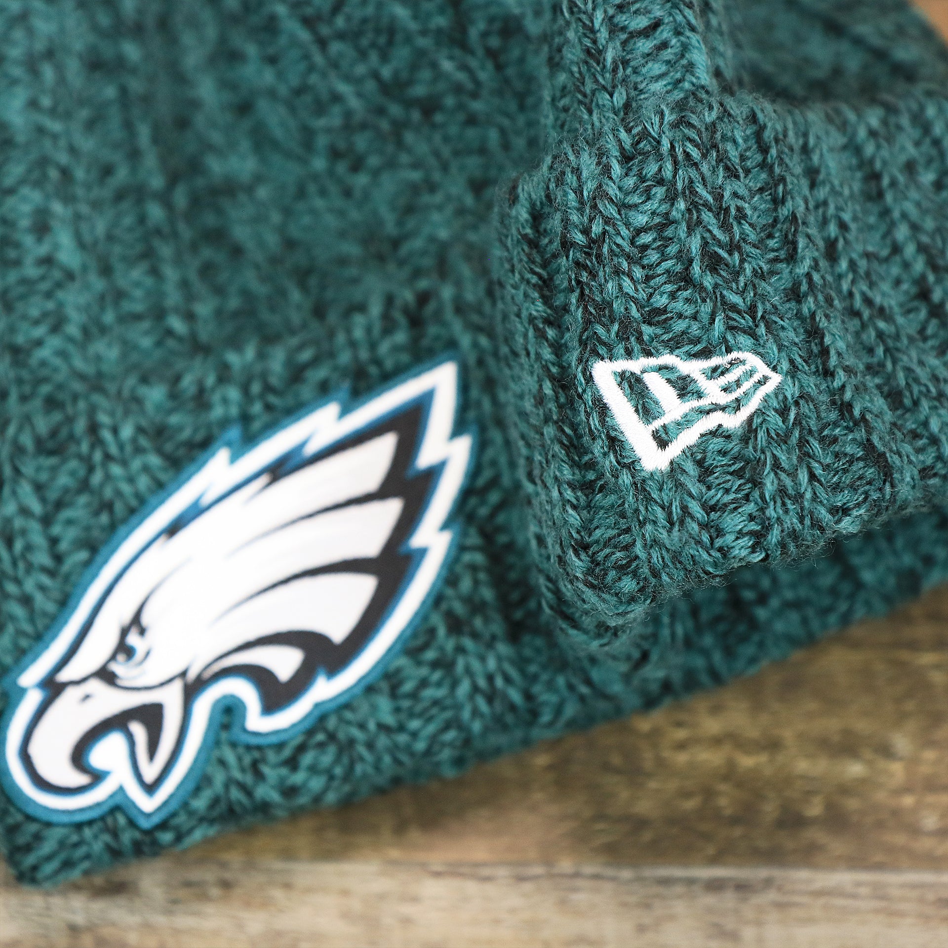 The New Era Logo on the Women’s Philadelphia Eagles Midnight Green On Field Knit Winter Beanie | Green Winter Beanie