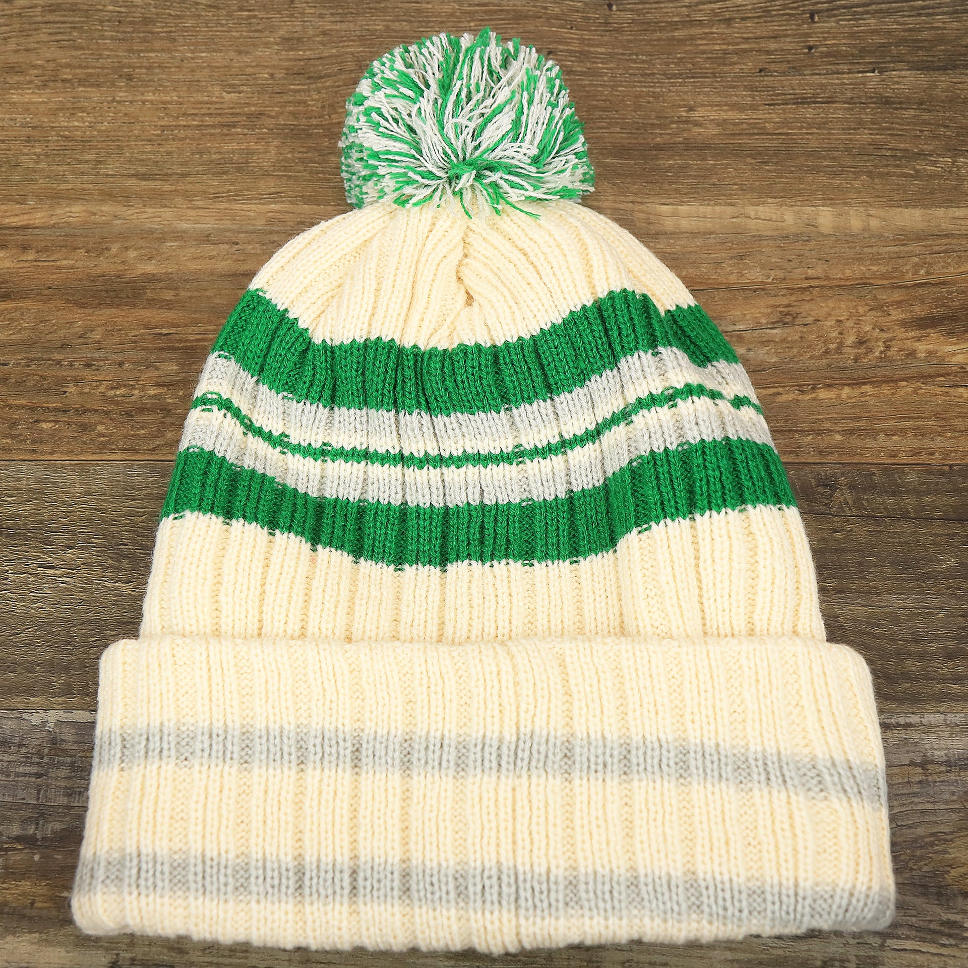 The backside of the Throwback Philadelphia Eagles Legacy 1987 Eagles Patch Pom Pom Beanie | Natural Beanie