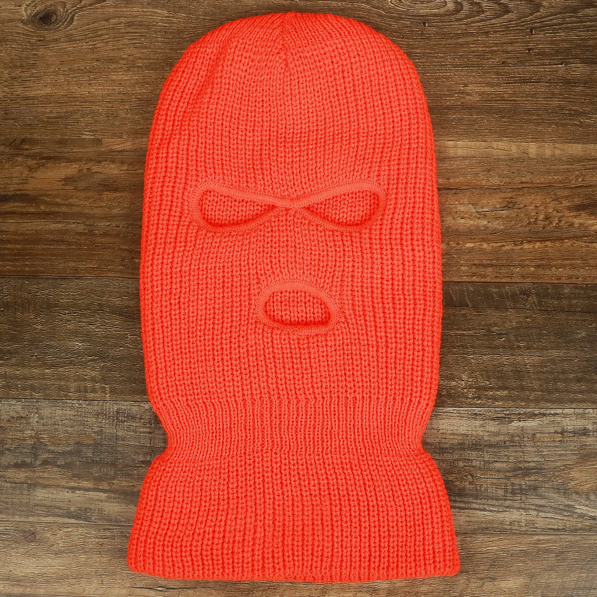 The Safety Orange Snug Fit Three Hole Balaclava | Neon Orange Knit Ski Mask on the floor