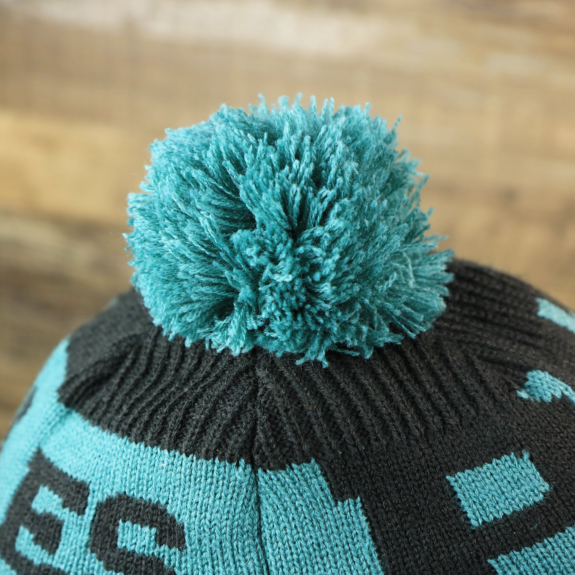 The Midnight Green Pom Pom on the Philadelphia Eagles Sideline On Field Pom Pom Winter Beanie | Black Winter Beanie