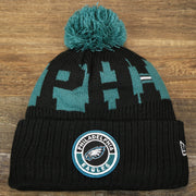 The front of the Philadelphia Eagles Sideline On Field Pom Pom Winter Beanie | Black Winter Beanie