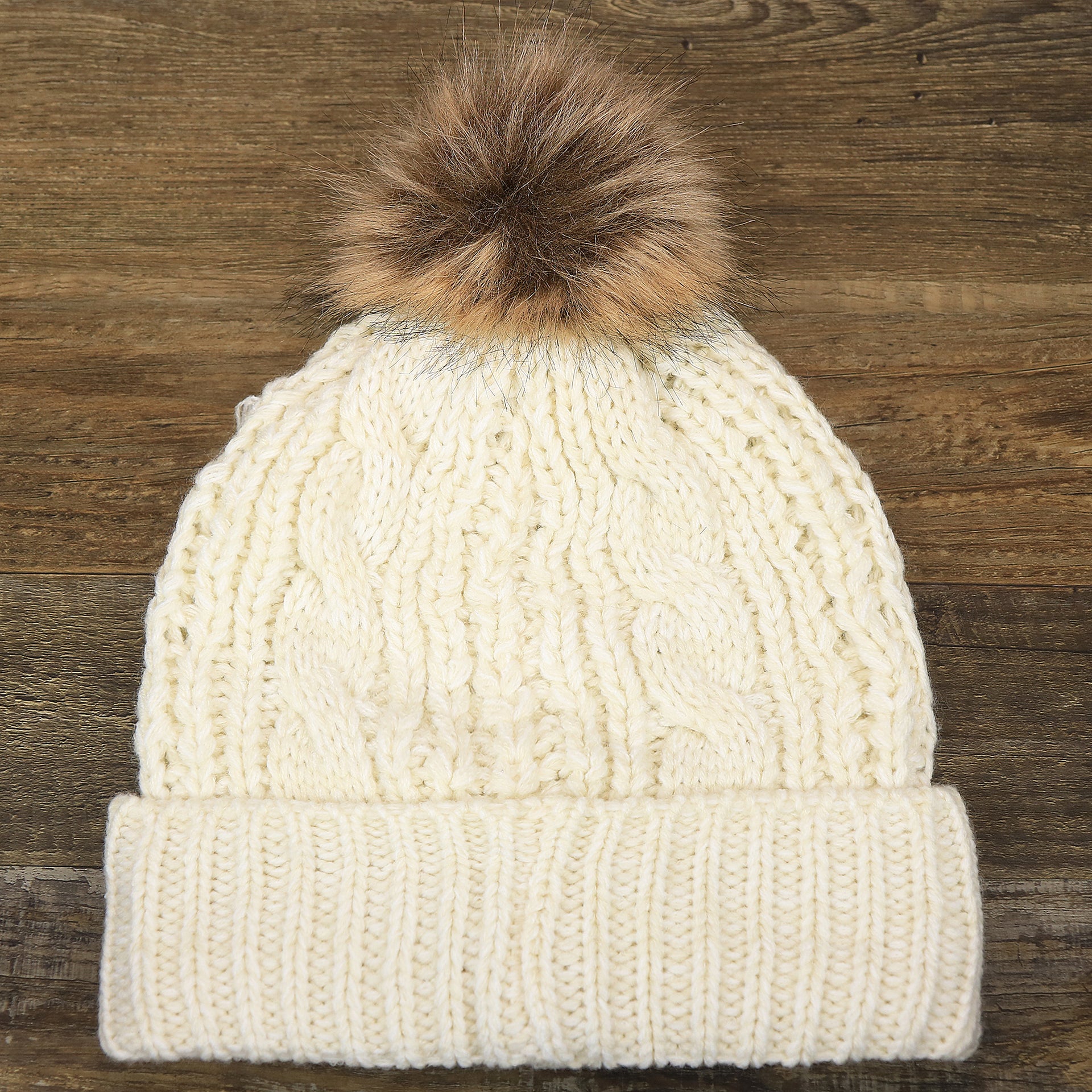 The backside of the Women’s Philadelphia Eagles Cuffed Winter Knit Beanie With Meeko Pom Pom | Women’s Cream Winter Beanie