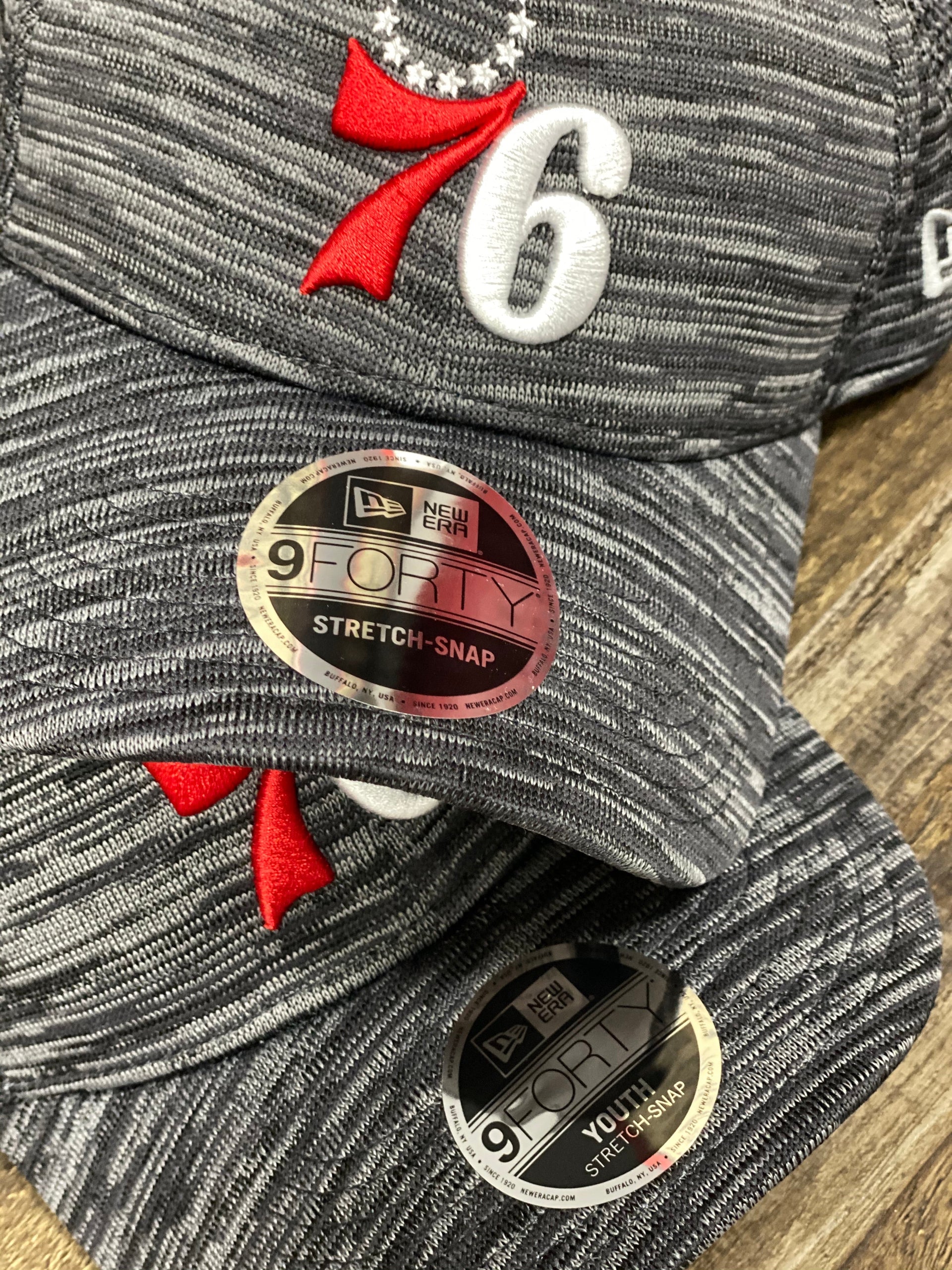 the Philadelphia 76ers Flyknit Look Space Dye Gray Trucker Dad Hat matches a kid size version of the hat