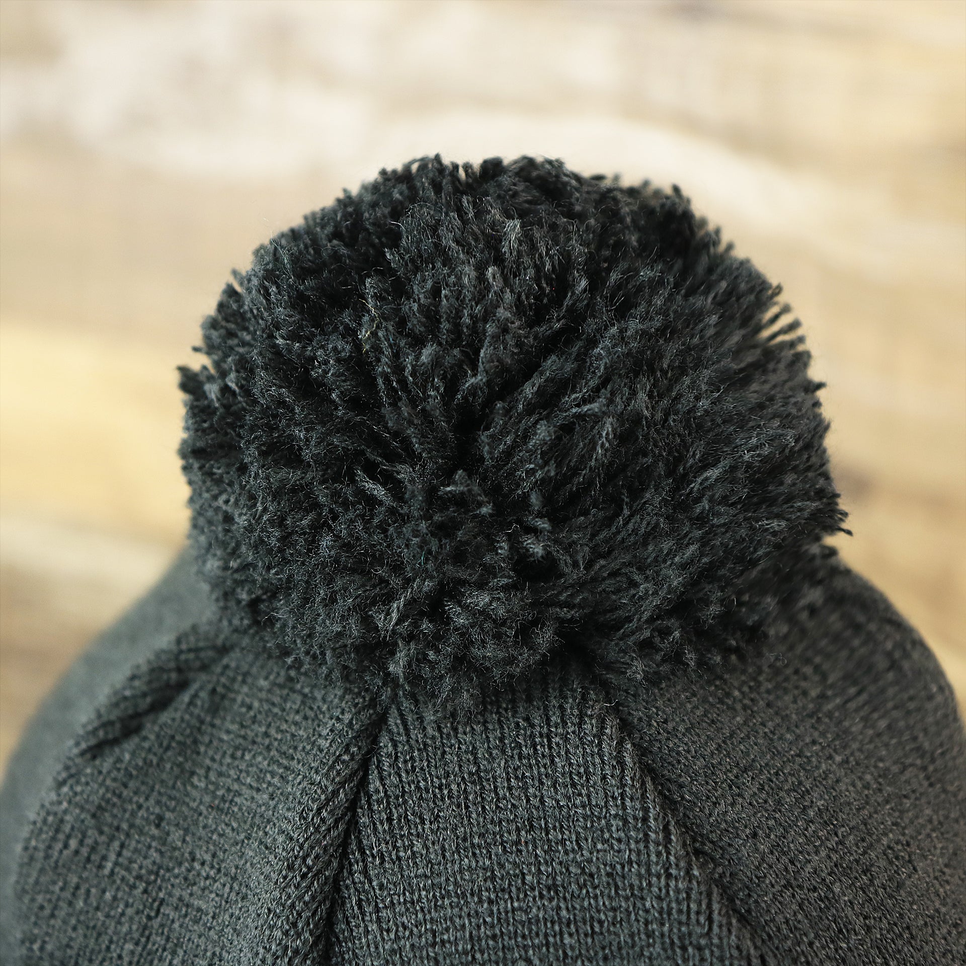 The Black Pom Pom on the Toronto Raptors NBA City Series Metallic Gold Leaf Winter Beanie | Black Winter Beanie