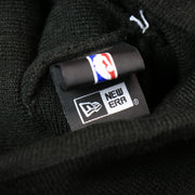 The New Era Tag on the Toronto Raptors NBA City Series Metallic Gold Leaf Winter Beanie | Black Winter Beanie