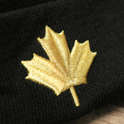 The Maple Leaf on the Toronto Raptors NBA City Series Metallic Gold Leaf Winter Beanie | Black Winter Beanie