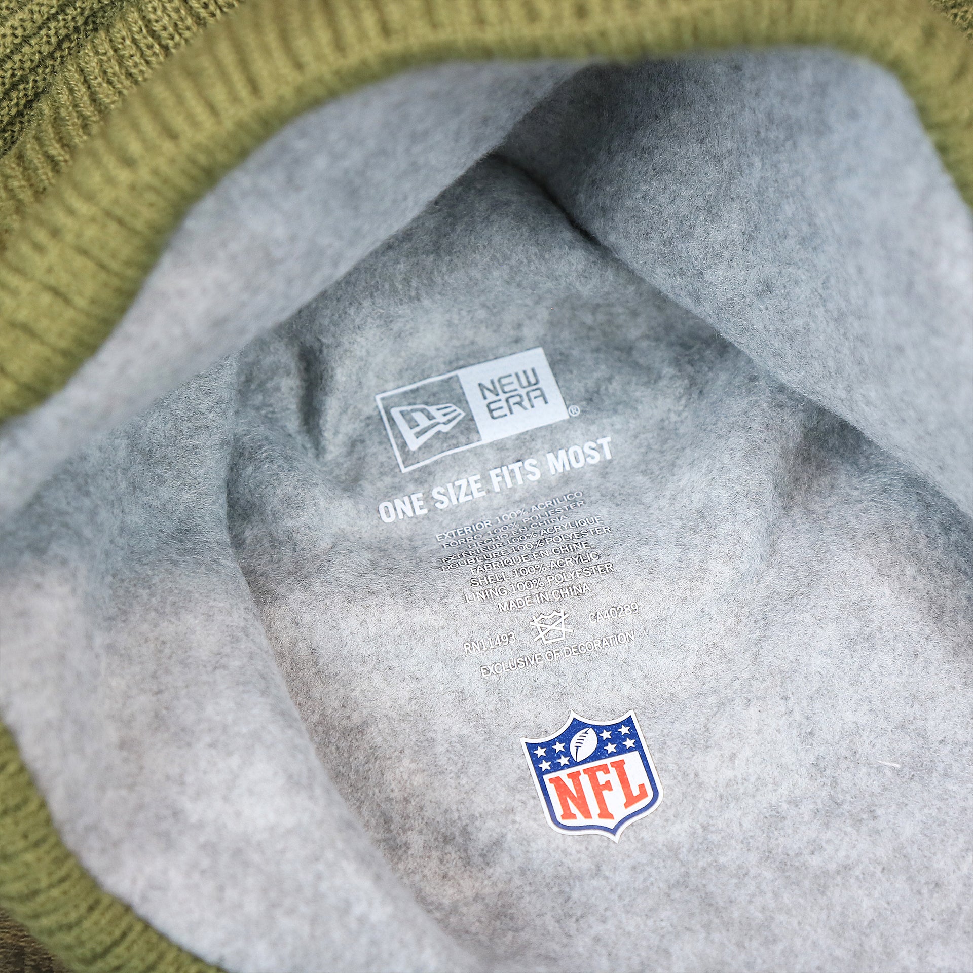 The Lining on the New York Giants Salute To Service Ribbon Rubber Military Giants Patch On Field NFL Beanie | Military Green Beanie