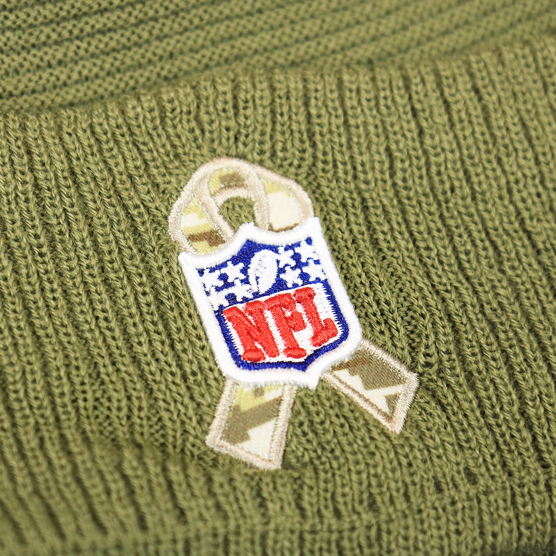 The Salute To Service Ribbon on the New York Giants Salute To Service Ribbon Rubber Military Giants Patch On Field NFL Beanie | Military Green Beanie