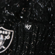 The 47 Brand Tag on the Women’s Las Vegas Raiders Reflective Silver Cuffed Pom Pom Winter Beanie | Black Winter Beanie