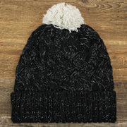The backside of the Women’s Las Vegas Raiders Reflective Silver Cuffed Pom Pom Winter Beanie | Black Winter Beanie