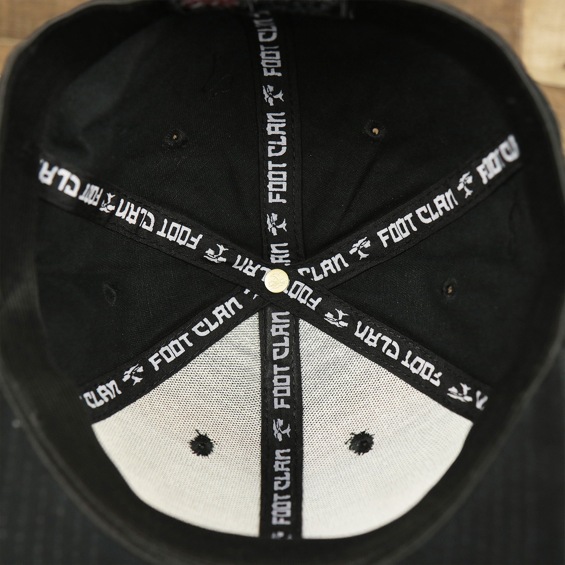 The inside of the Jet Black Structured Cotton Blank Small Fit Flexfit Cap | Black Stretch Fit Caps