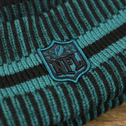 The NFL Logo on the Philadelphia Eagles Patch 1933 On Field Striped Eagles Colorway Pom Pom Winter Beanie | Black and Midnight Green Winter Beanie