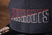 The patriots name is navy with a white and red outline Patriots 2020 Training Camp Snapback Hat | New England Patriots 2020 On-Field Navy Training Camp Snap Cap