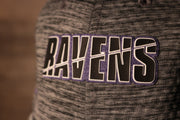 The ravens name is black with an outline of white and a purple background Ravens 2020 Training Camp Flexfit | Baltimore Ravens 2020 On-Field Grey Training Camp Stretch Fit