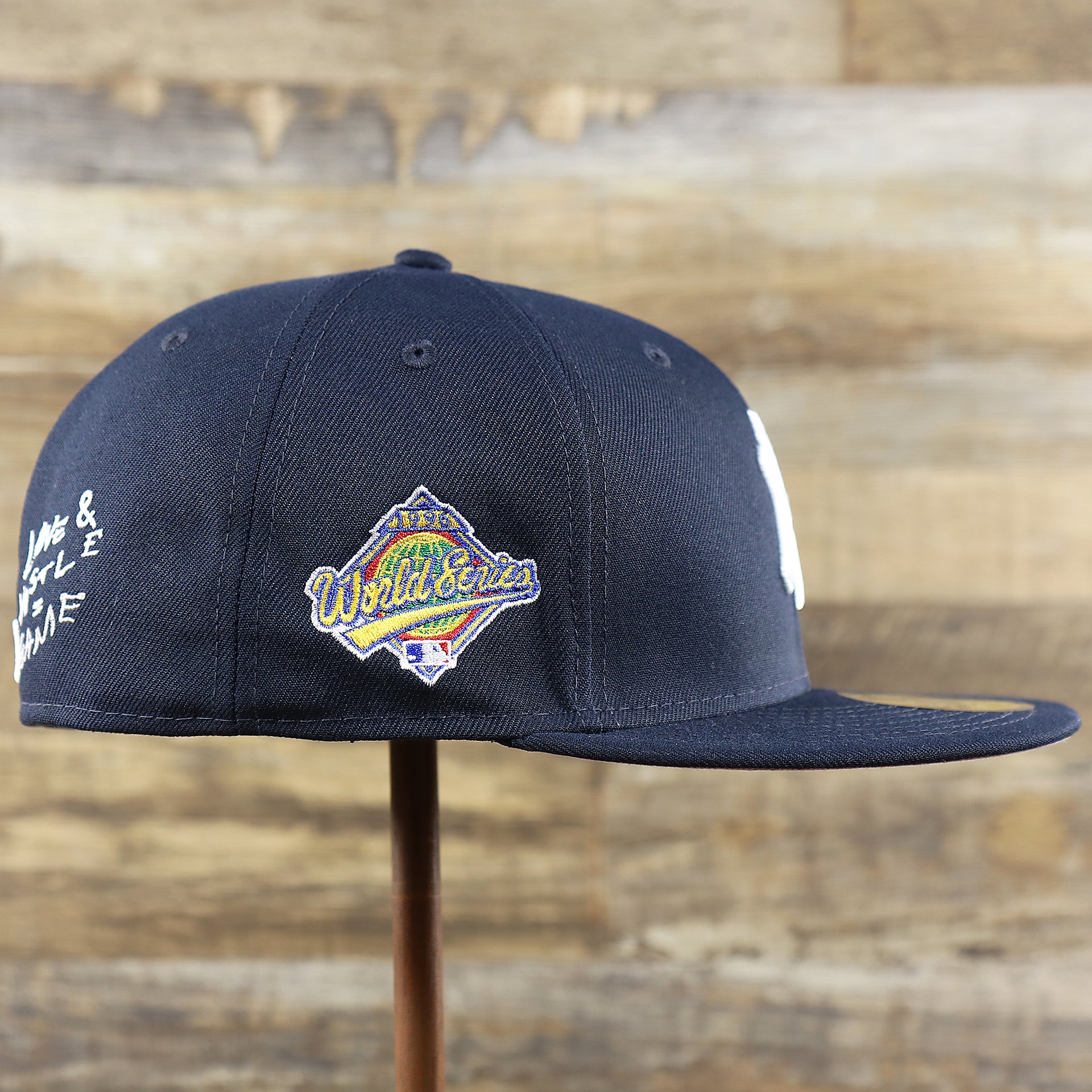 The wearer's right on the New York Yankees Baseball Heart Gray Bottom World Series 59Fifty Fitted Cap | Navy 59Fifty Cap