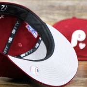 The Gray Bottom on the Cooperstown Philadelphia Phillies Baseball Heart Gray Bottom World Series 59Fifty Fitted Cap | Maroon 59Fifty Cap