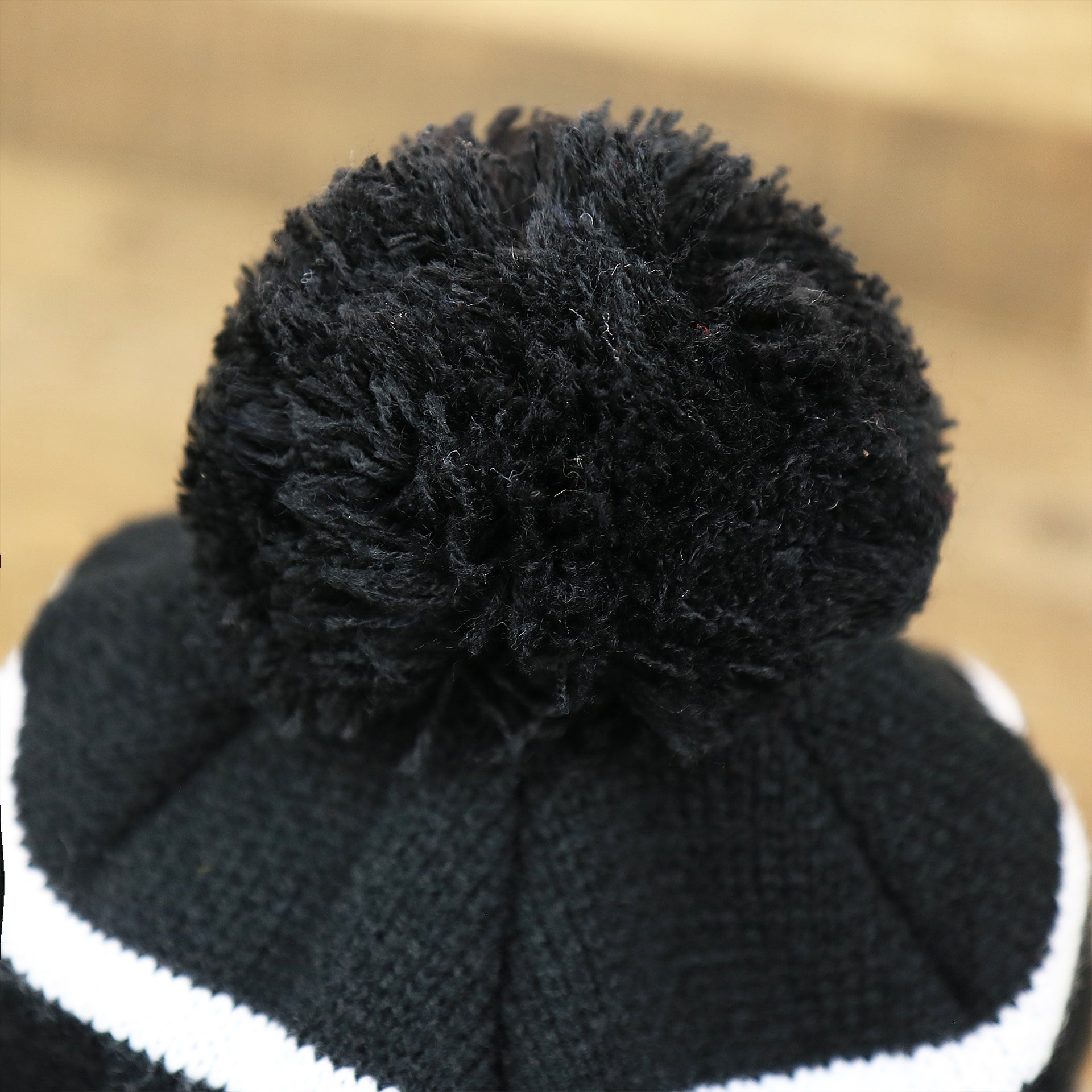 The Black Pom Pom on the Philadelphia Eagles 2017 NFC Champions Gray Cuff NFL Pom Pom Winter Beanie | Black Winter Beanie
