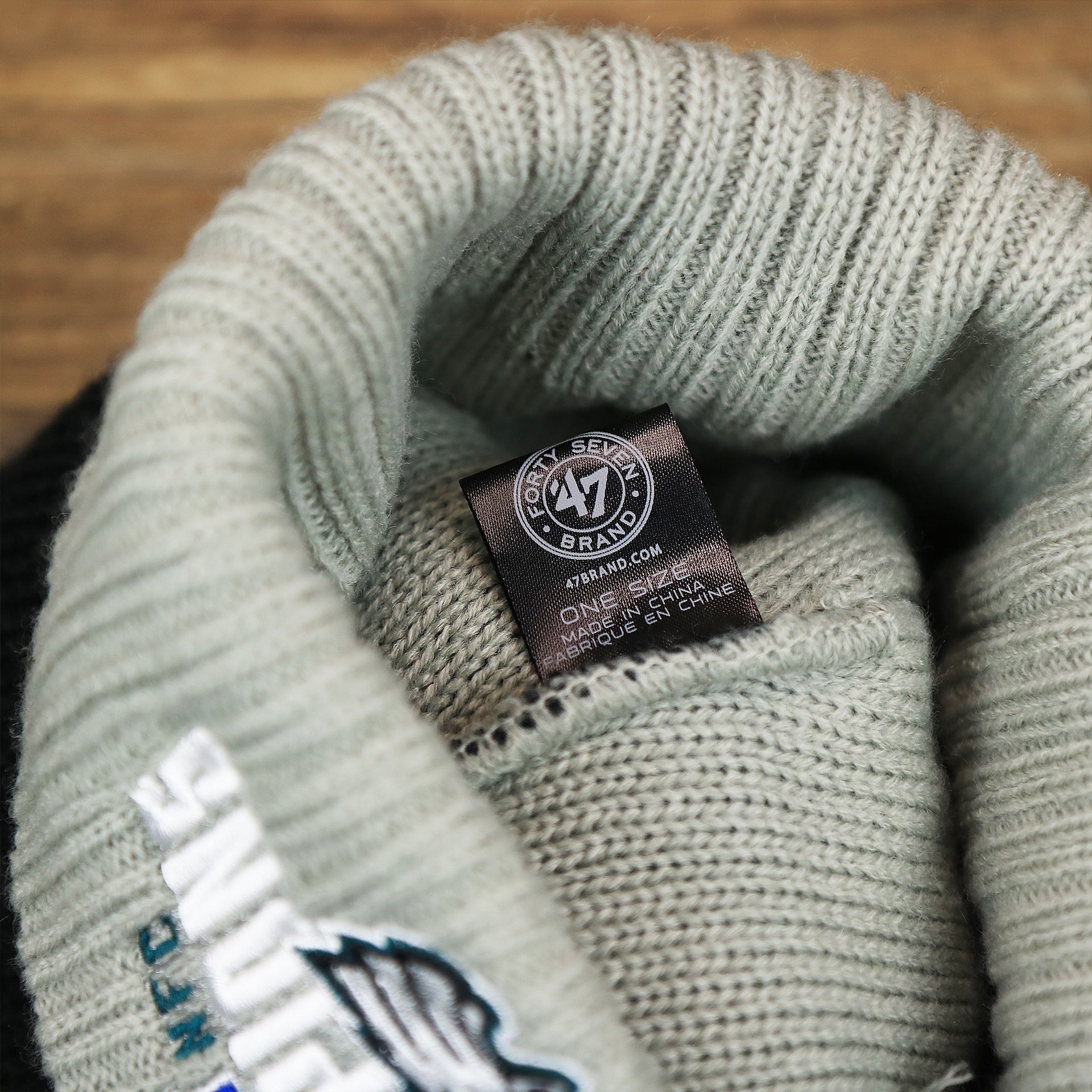 The 47 Brand Tag on the Philadelphia Eagles 2017 NFC Champions Gray Cuff NFL Pom Pom Winter Beanie | Black Winter Beanie