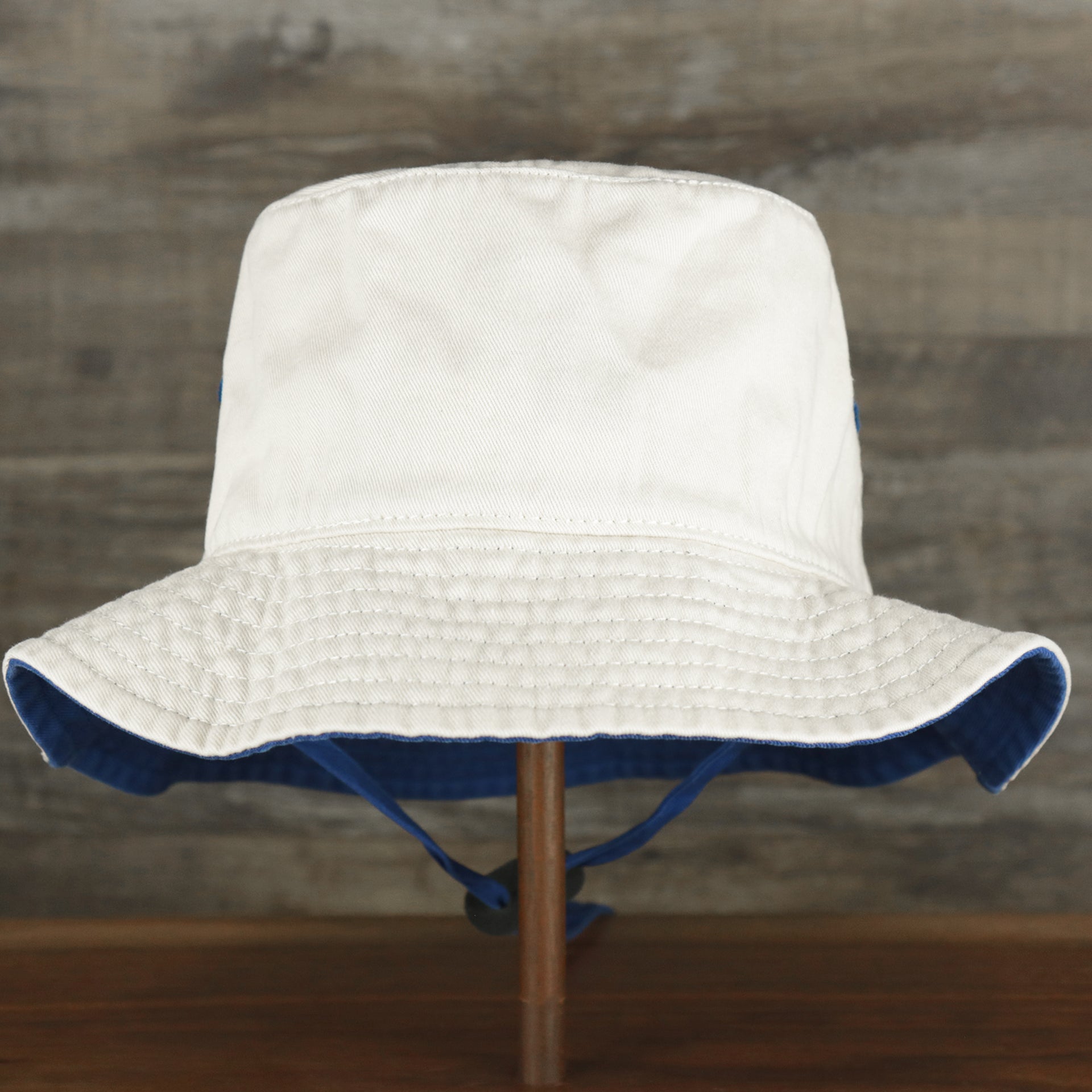 The backside of the Philadelphia 76ers Logo Royal Blue Undervisor Bucket Hat | Natural Bucket Hat