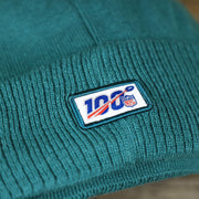 The NFL 100 Logo on the Philadelphia Eagles On Field Since 1933 Eagles Patch Winter Pom Pom Beanie | Midnight Green Winter Beanie