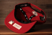 The underside is red with a stretchy material 49ers 2020 Training Camp Snapback Hat | San Francisco 2020 On-Field Red Training Camp Snap Cap