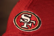 49ers 2020 Training Camp Snapback Hat | San Francisco 2020 On-Field Red Training Camp Snap Cap the niners logo is on the back
