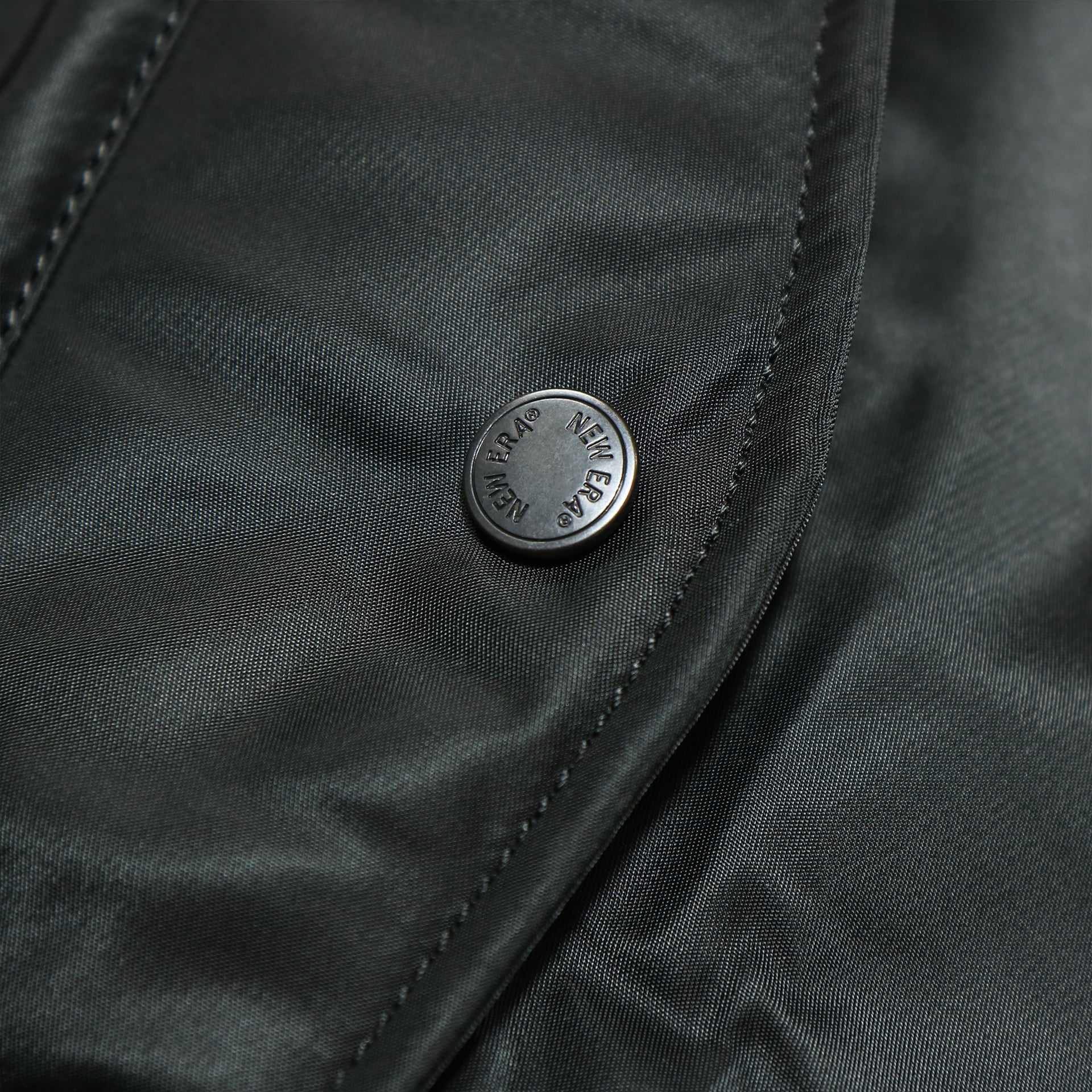 new era button on the Florida Marlins MLB Patch Alpha Industries Reversible Bomber Jacket With Camo Liner | Black Bomber Jacket