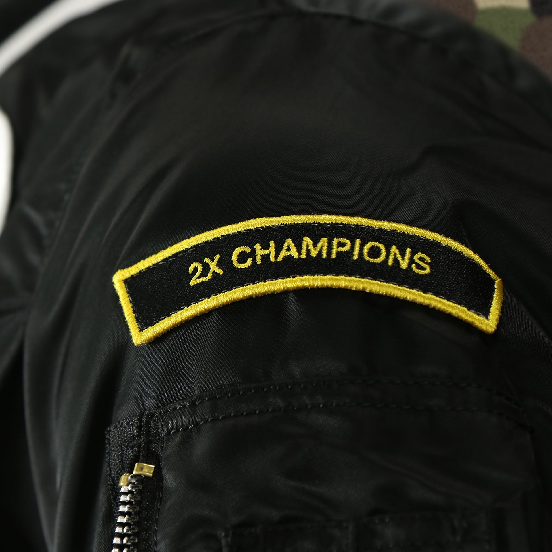 2X champions patch on the Florida Marlins MLB Patch Alpha Industries Reversible Bomber Jacket With Camo Liner | Black Bomber Jacket