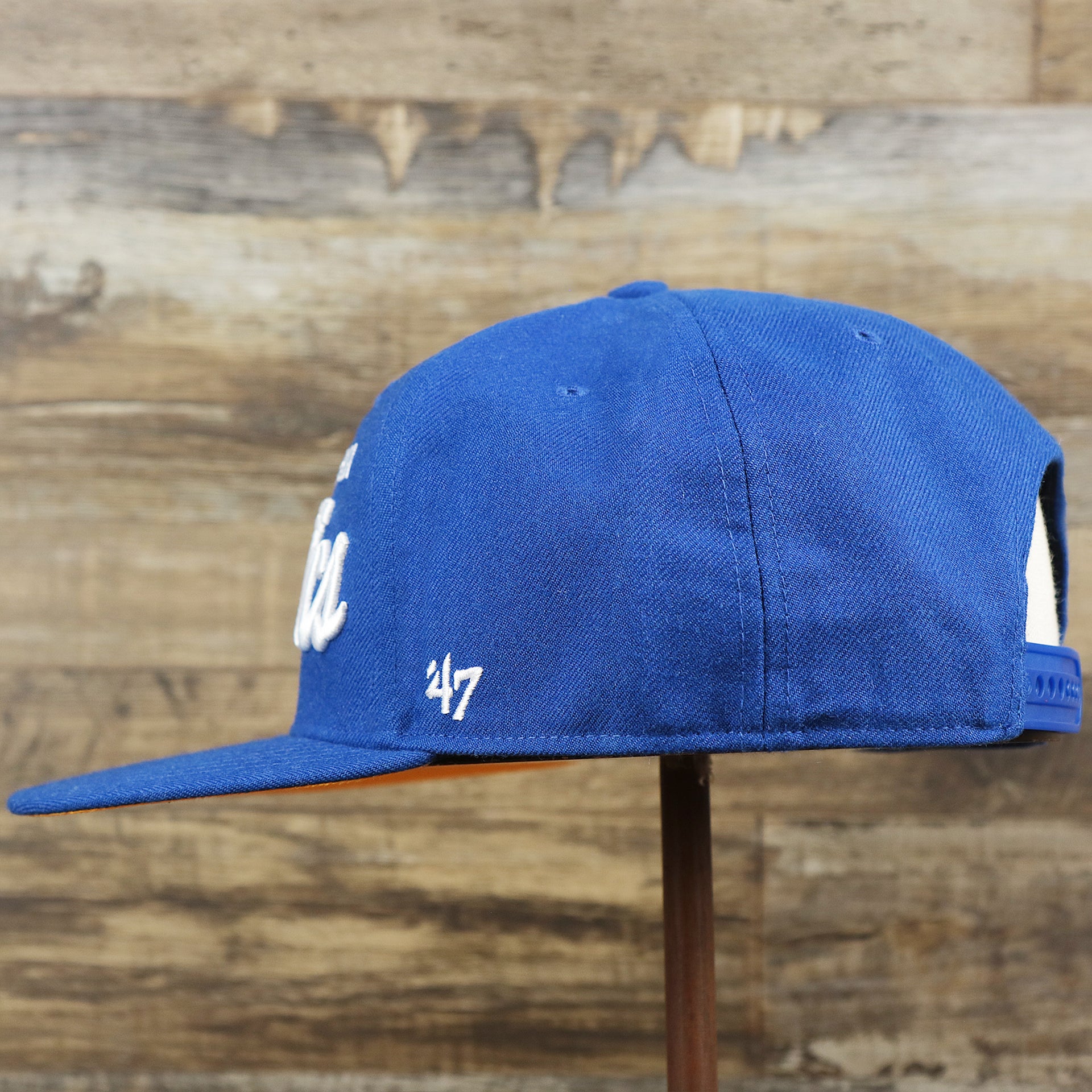 The wearer's left on the Cooperstown Philadelphia Athletics Wordmark Retro Athletics Side Patch Snapback | Royal Blue Snapback