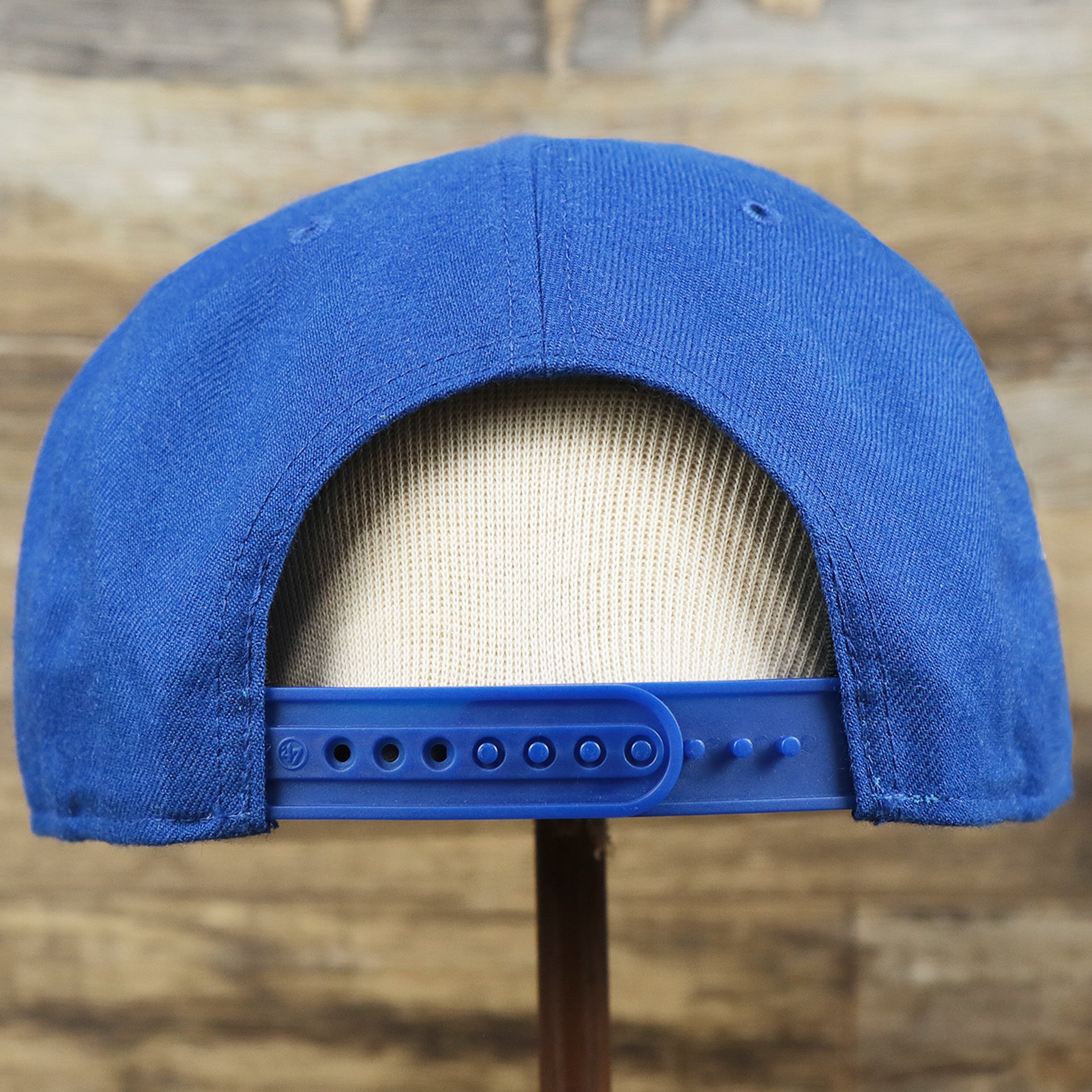 The backside of the Cooperstown Philadelphia Athletics Wordmark Retro Athletics Side Patch Snapback | Royal Blue Snapback