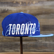 The wearer's right on the Cooperstown Toronto Blue Jays MLB Side Font Green Bottom 9Fifty Snapback Cap | Royal Blue Snap Cap