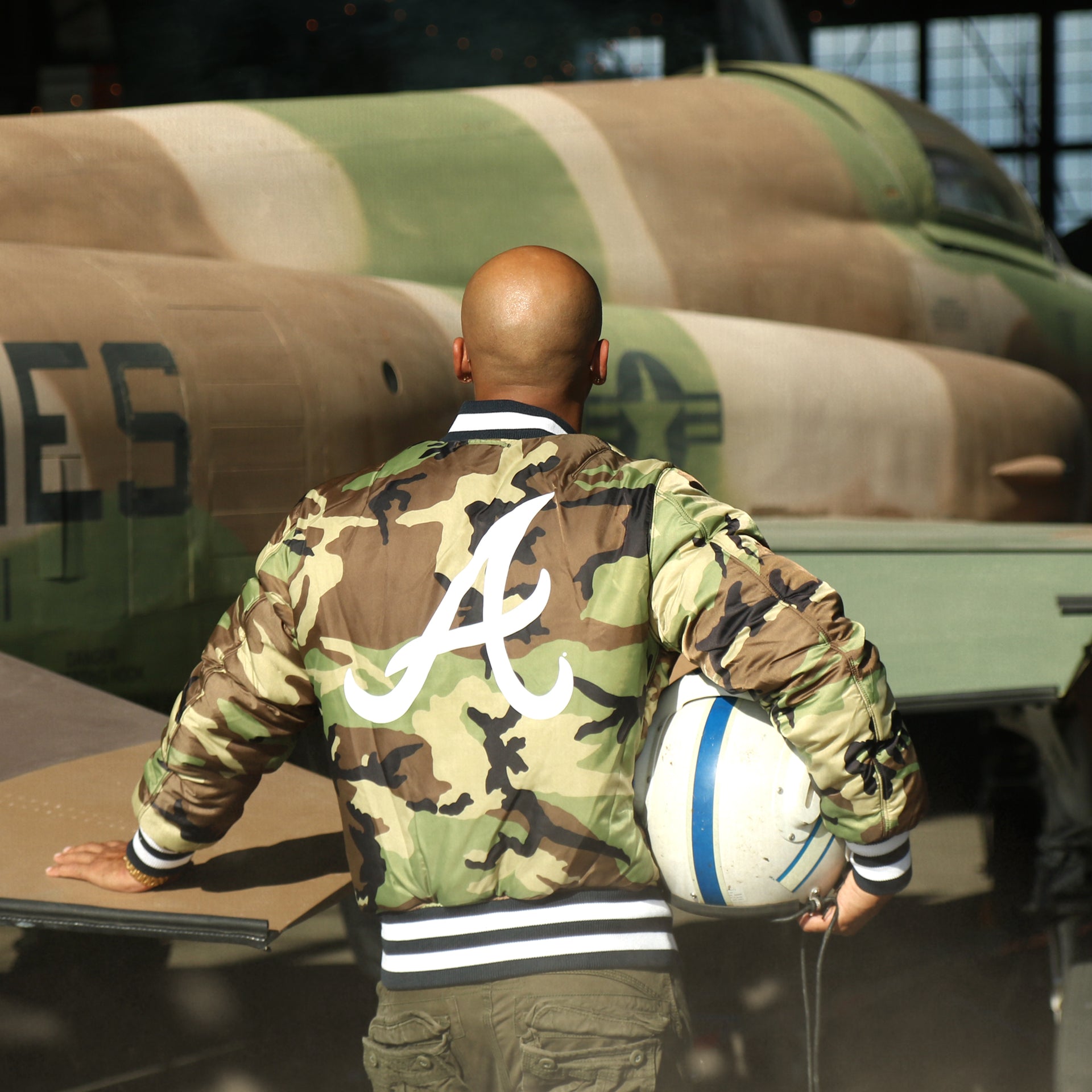 The backside of the liner on the Atlanta Braves MLB Patch Alpha Industries Reversible Bomber Jacket With Camo Liner | Navy Blue Bomber Jacket