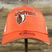 The front of the Nascar Chase Elliot Number 9 Hendrick Motorsport Hooters Logo 39Thirty FlexFit Cap | Orange 39Thirty Cap