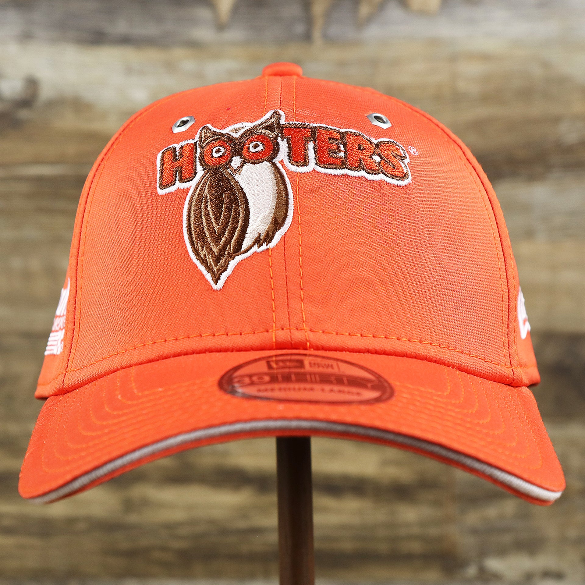 The front of the Nascar Chase Elliot Number 9 Hendrick Motorsport Hooters Logo 39Thirty FlexFit Cap | Orange 39Thirty Cap