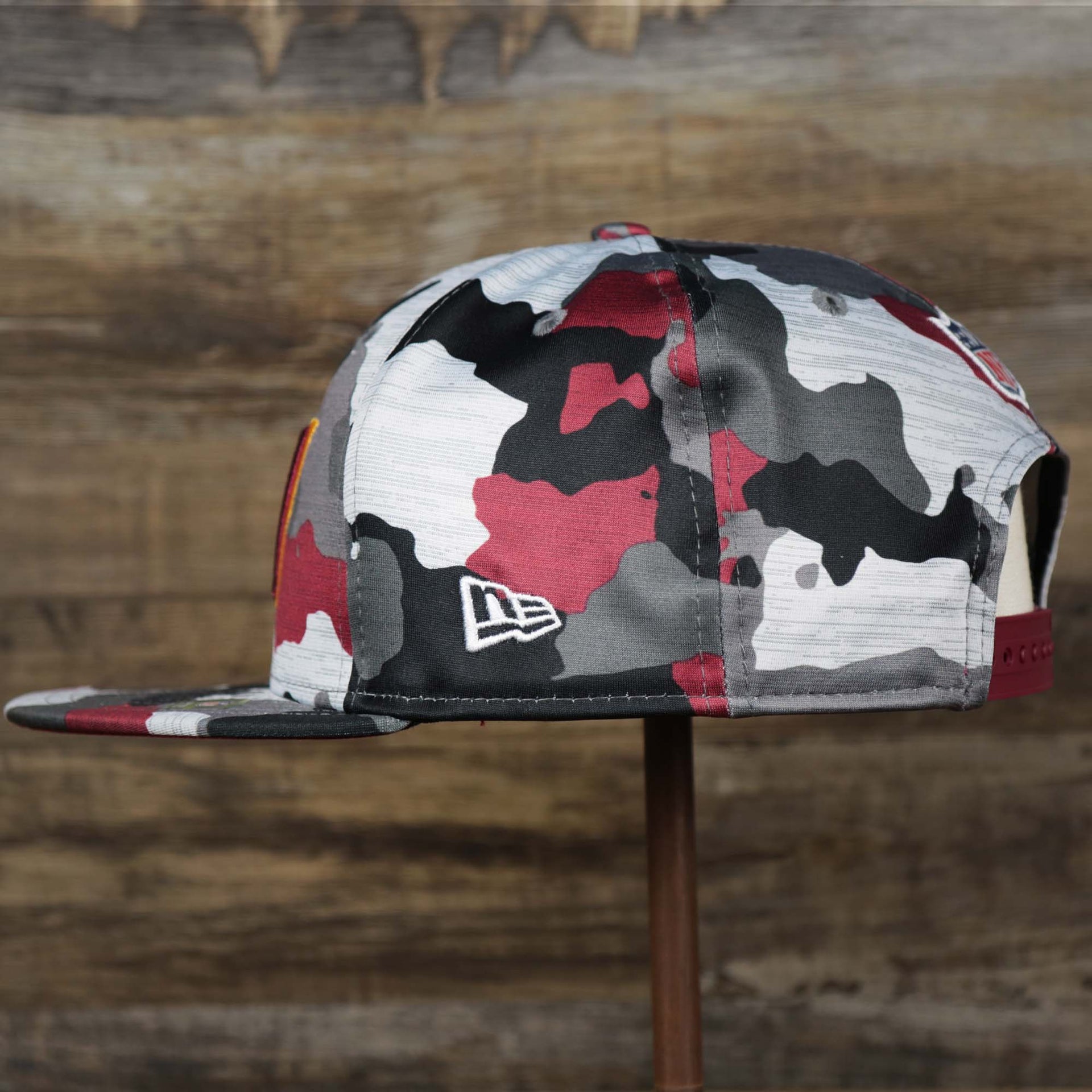 The Wearer's Left on the Washington Commanders NFL OnField Summer Training 2022 Camo 9Fifty Snapback | Burgundy Camo 9Fifty