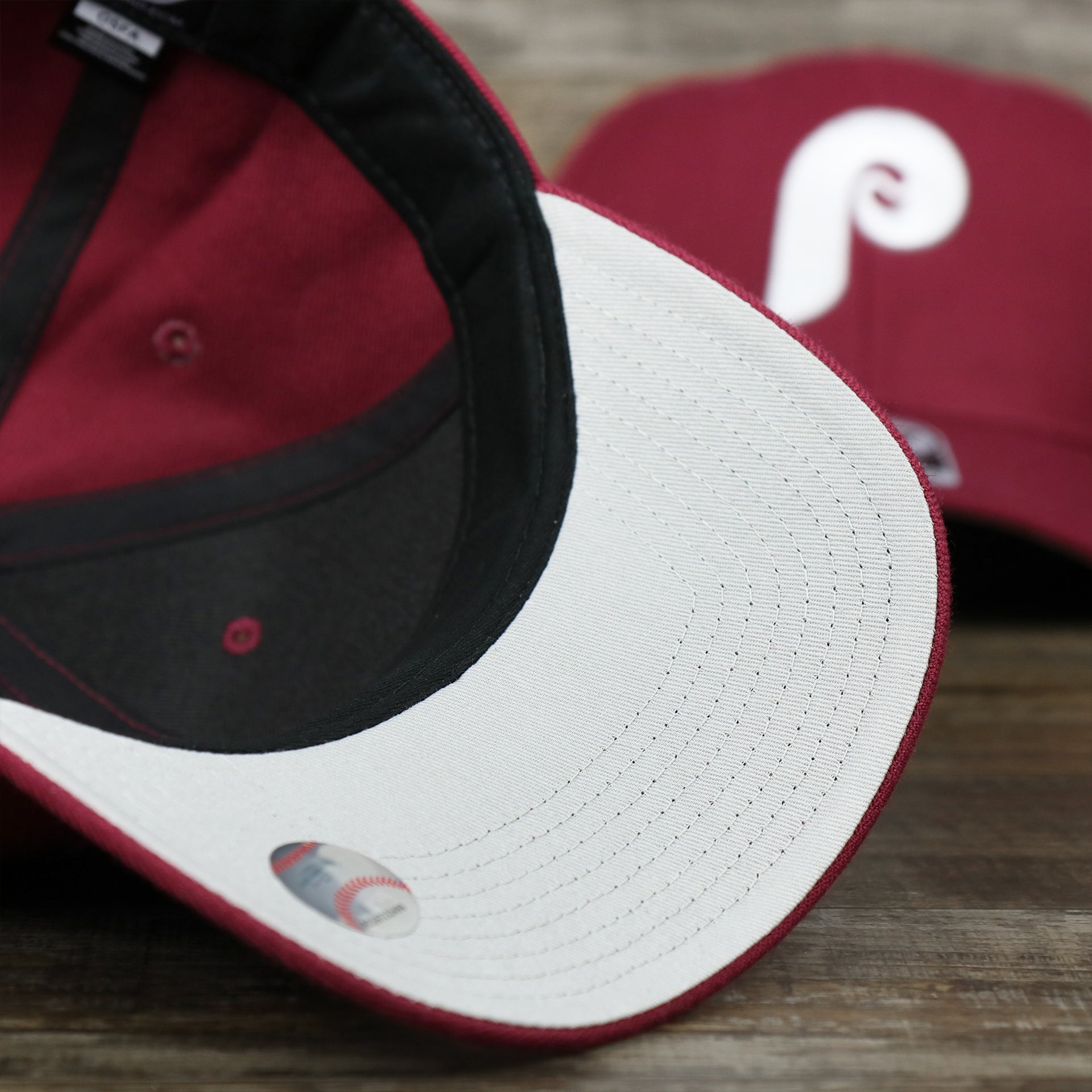The undervisor on the Cooperstown Philadelphia Phillies Retro Phillies Logo Gray Bottom Dad Hat | Maroon Dad Hat