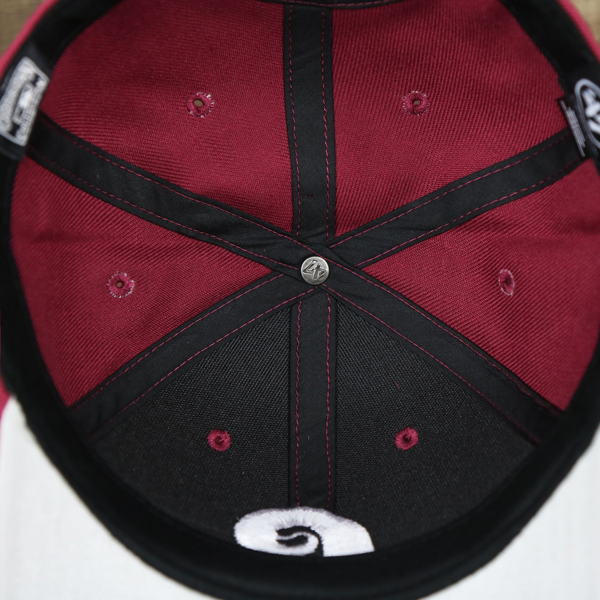 The inside of the Cooperstown Philadelphia Phillies Retro Phillies Logo Gray Bottom Dad Hat | Maroon Dad Hat