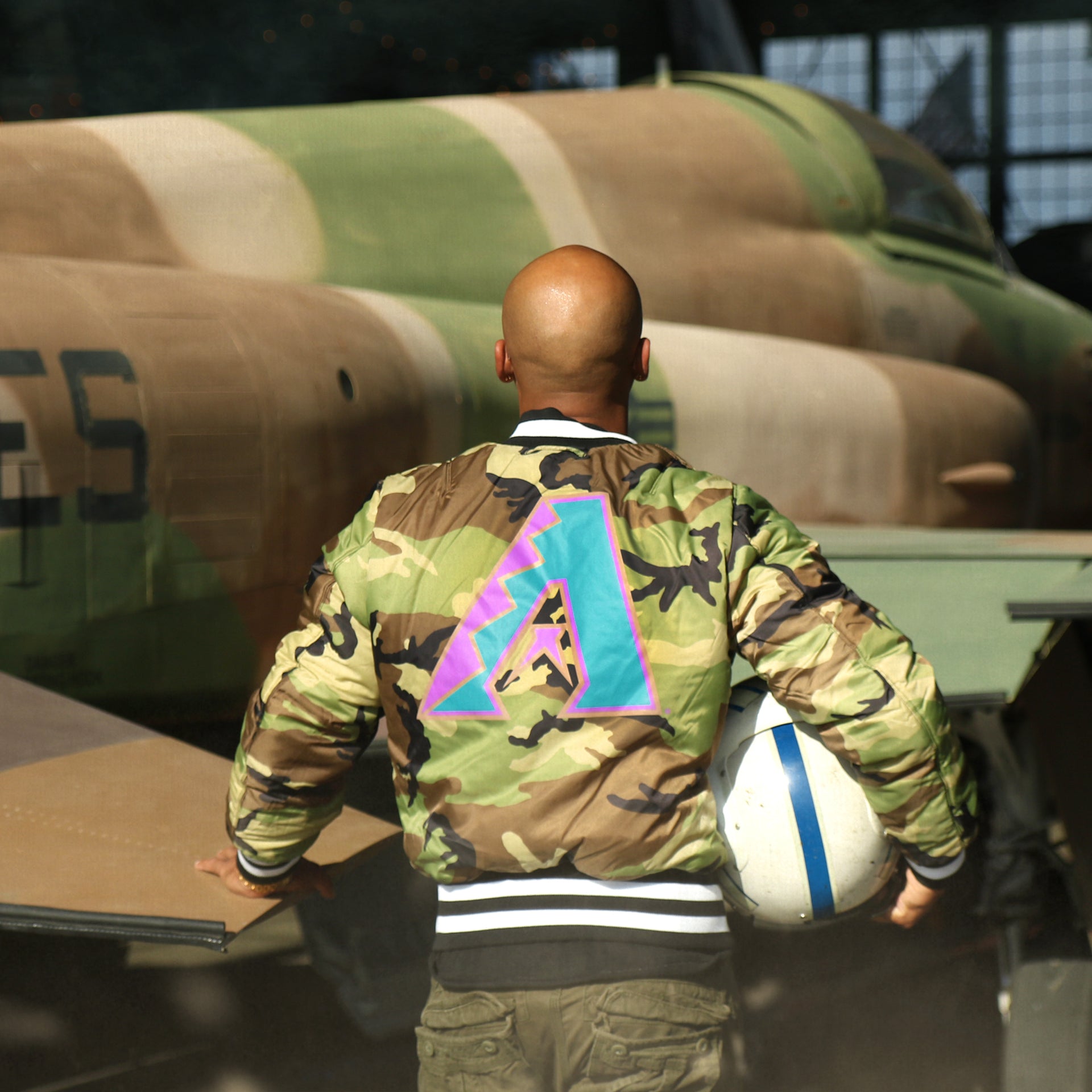 The backside of the liner on the Cooperstown Arizona Diamondbacks MLB Patch Alpha Industries Reversible Bomber Jacket With Camo Liner | Black Bomber Jacket