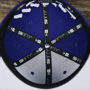 The inside of the Los Angeles Dodgers Crown Champions Gray Bottom World Championship Wins Embroidered Fitted Cap | Royal Blue 59Fifty Cap