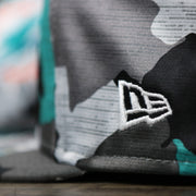 The New Era Logo on the Miami Dolphins NFL OnField Summer Training 2022 Camo 9Fifty Snapback | Turquoise Camo 9Fifty