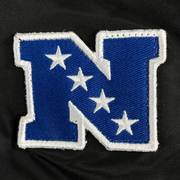 Close up of the NFC patch on the Philadelphia Eagles Throwback Men’s Vintage Reversible Bomber Jacket | Alpha Industries x New Era