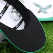 The undervisor on the Throwback Philadelphia Eagles Chrome Logo NFL Eagles SIde Patch 59Fifty Fitted Cap | Cream Fitted Cap