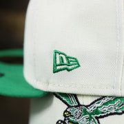 The New Era Logo on the Throwback Philadelphia Eagles Chrome Logo NFL Eagles SIde Patch 59Fifty Fitted Cap | Cream Fitted Cap