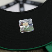 The NFL Sticker on the Throwback Philadelphia Eagles Chrome Logo NFL Eagles SIde Patch 59Fifty Fitted Cap | Cream Fitted Cap