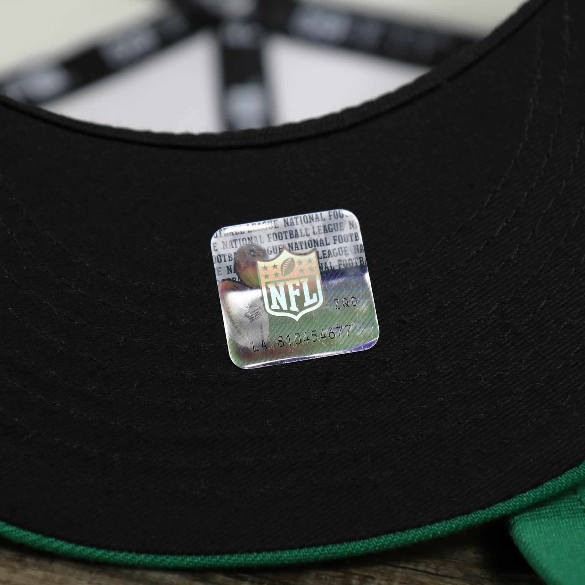 The NFL Sticker on the Throwback Philadelphia Eagles Chrome Logo NFL Eagles SIde Patch 59Fifty Fitted Cap | Cream Fitted Cap